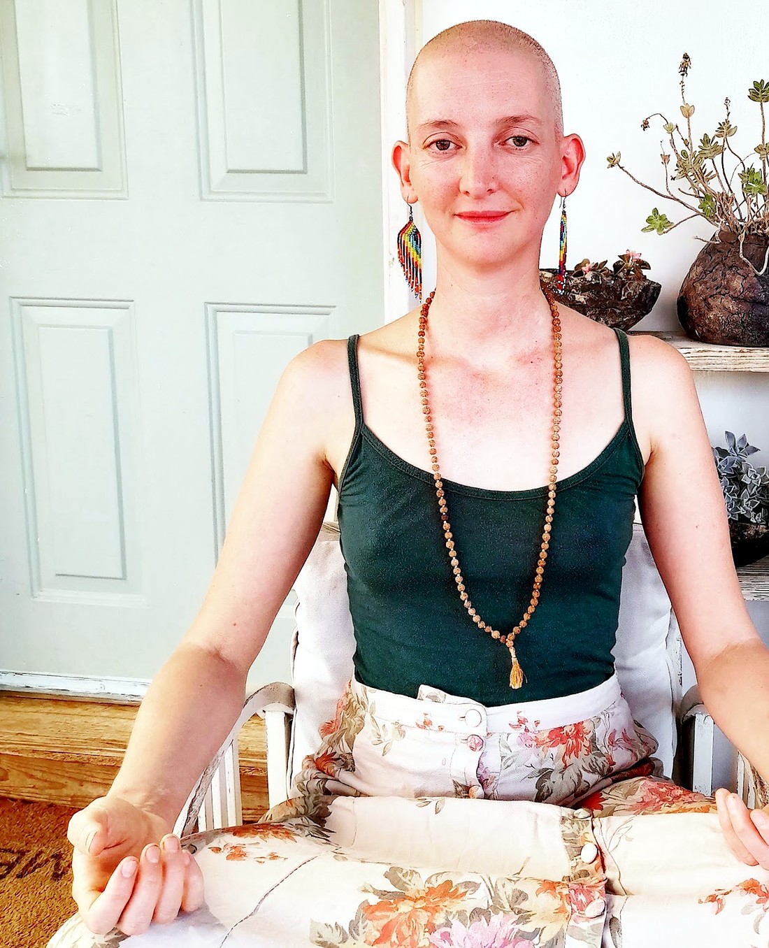 Maya Nassi in quiet meditation in a garden