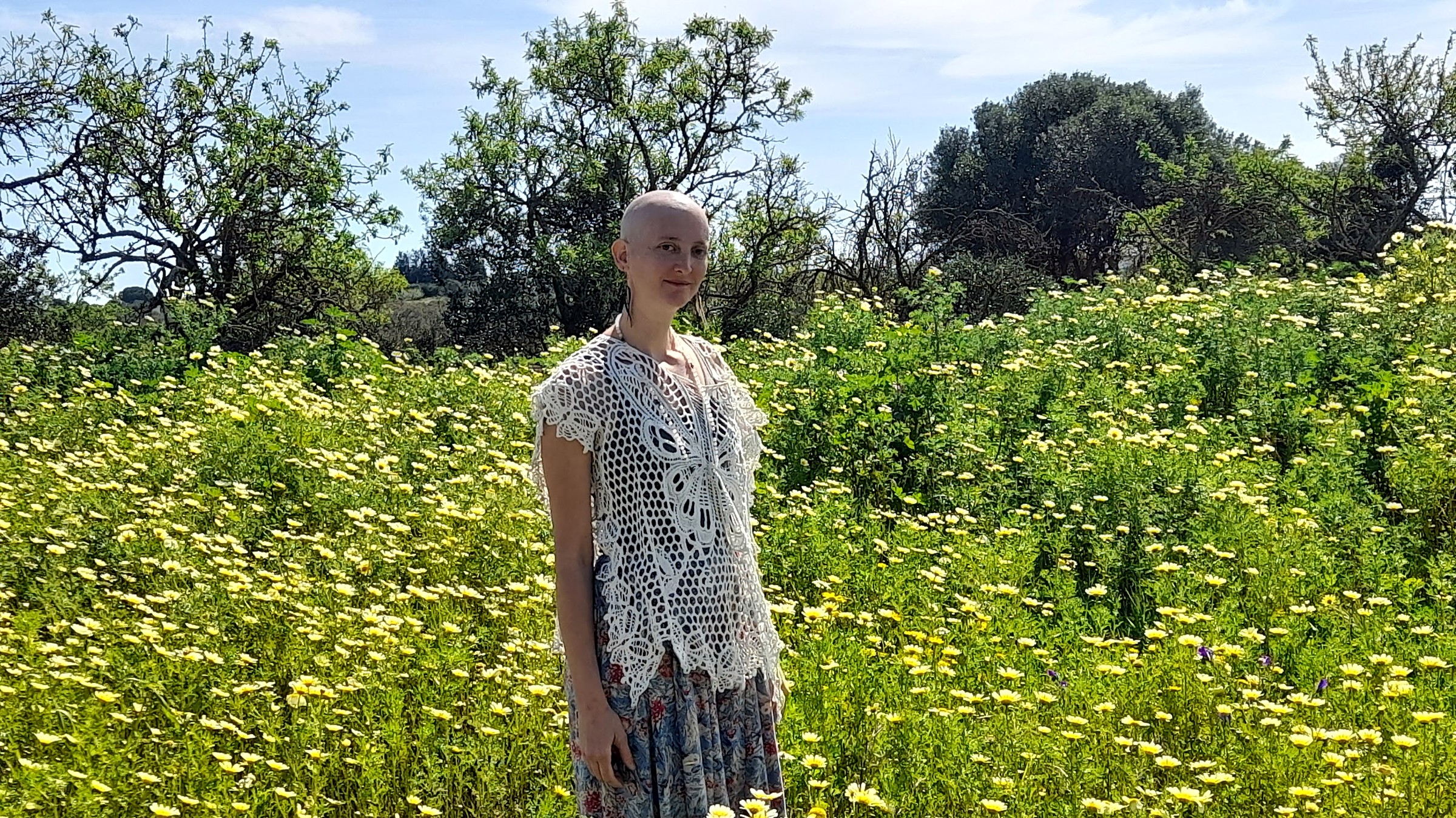 Maya Nassi standing in an open flower field